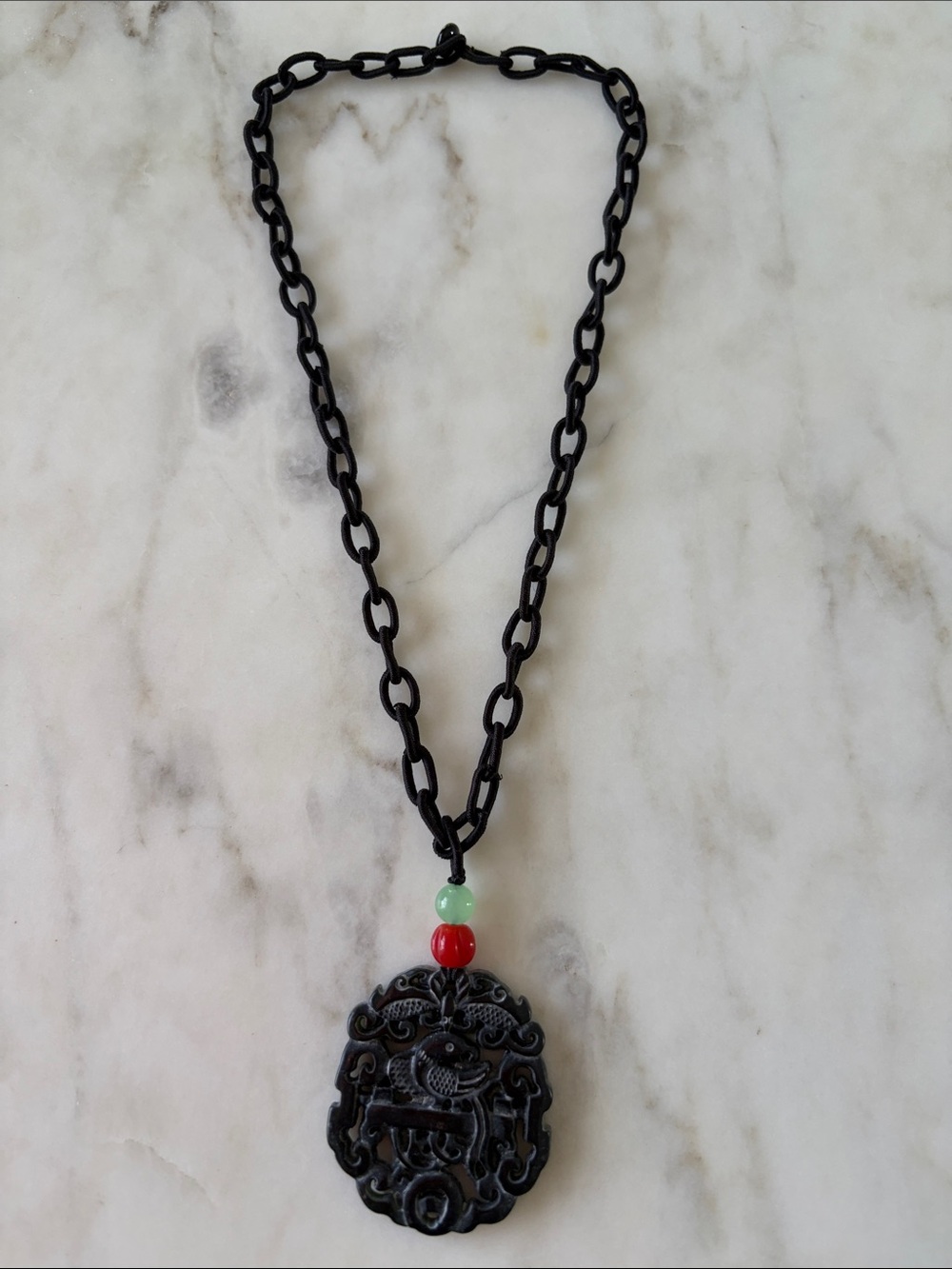 Black onyx Carved Necklace with Red and Green stone beads on silk link cord